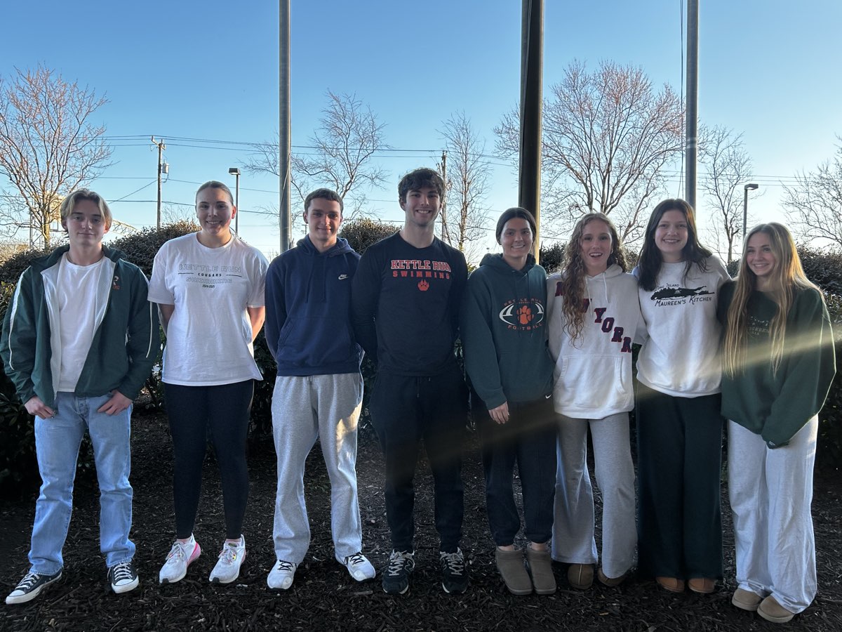 Kettle Run swimmers standing together outside on a sunny winter day
