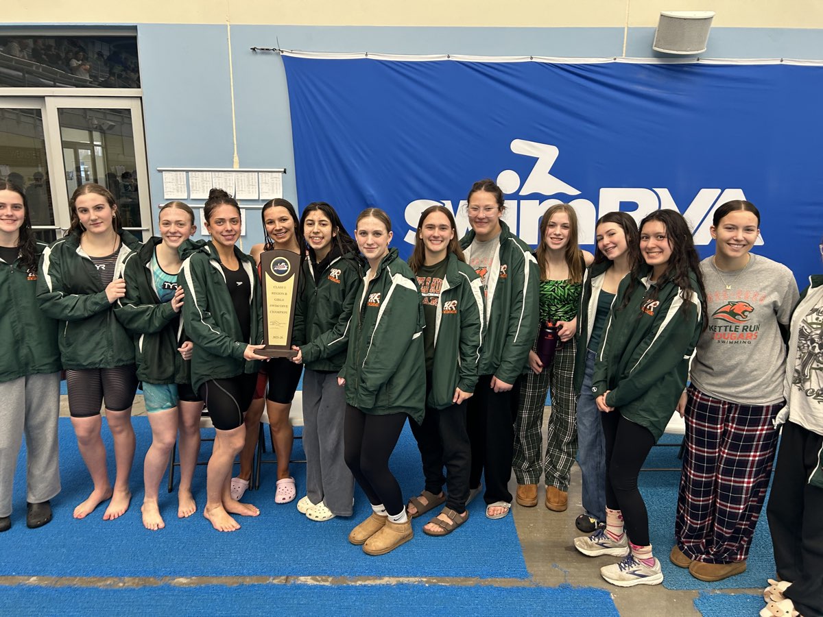 The Kettle Run girls team with a championship trophy at SwimRVA